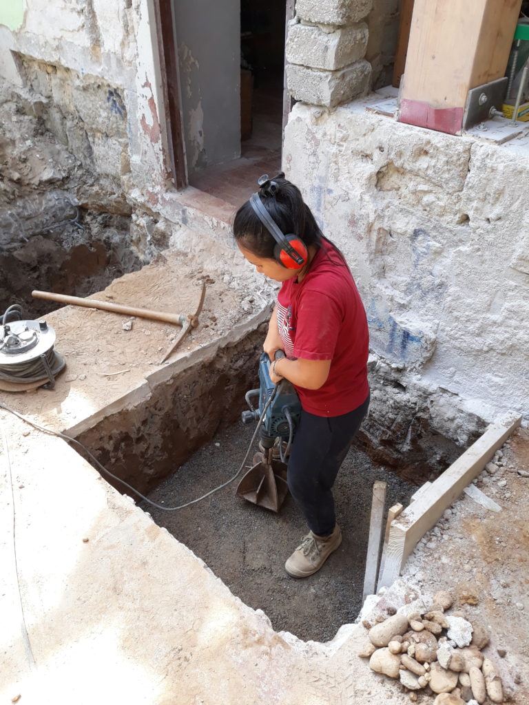 Woman levelling ground