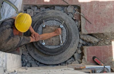 Man in hard hat tightening bolt